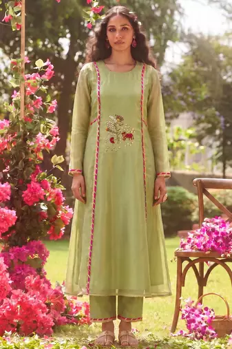 Elegant pista green tissue kurta pant set featuring palm motifs with delicate sequin and bead work, finished.