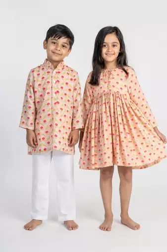 Peach printed cotton dress & kurta pant brother sister matching combo