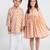Peach printed cotton dress & kurta pant brother sister matching combo
