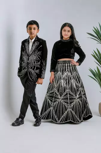 Black embroidered velvet lehenga choli & tuxedo brother sister matching combo