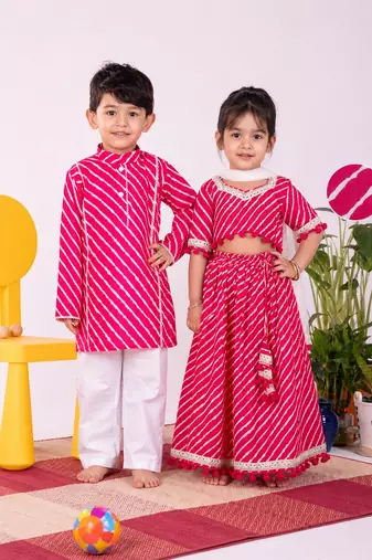 Pink & white leheriya & printed cotton lehenga choli & kurta pyjama brother sister matching combo
