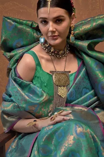 Woven design zari silk blend kanjeevaram saree with matching blouse