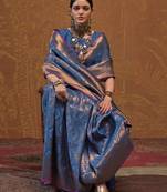 Woven design zari silk blend kanjeevaram saree with matching blouse