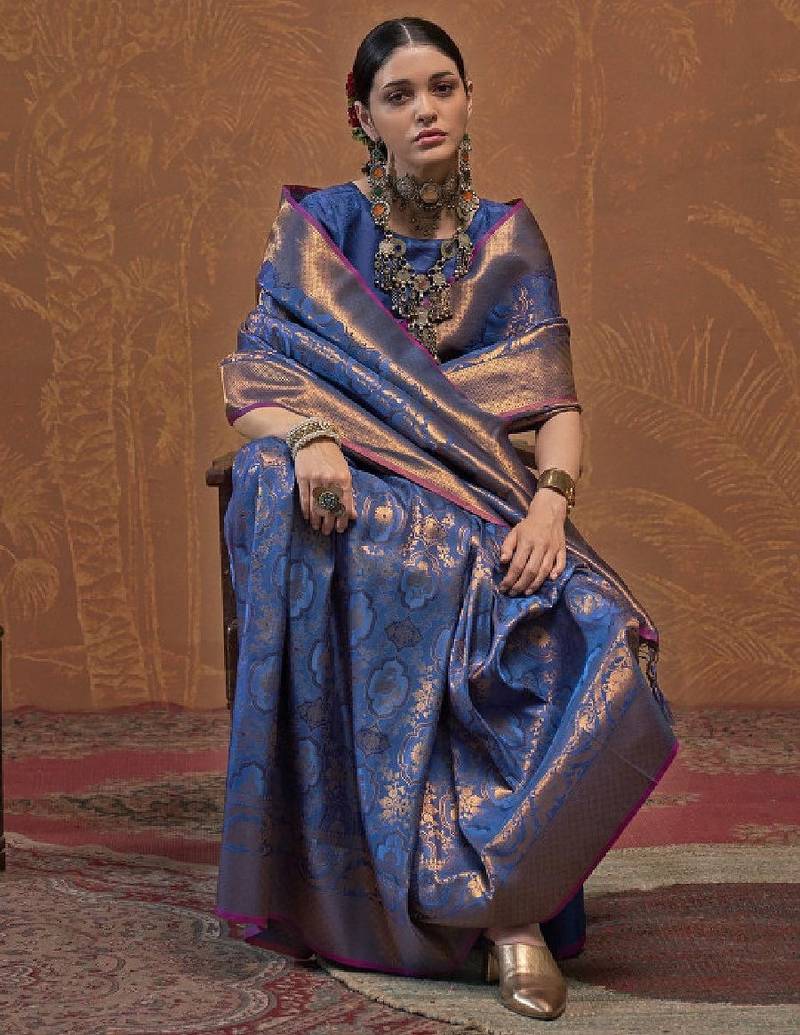 Woven design zari silk blend kanjeevaram saree with matching blouse