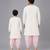Cow printed pink and off white kurta payjama father son combo set