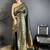 Dark green banarasi soft silk checked body floral motifs south pattu sarees