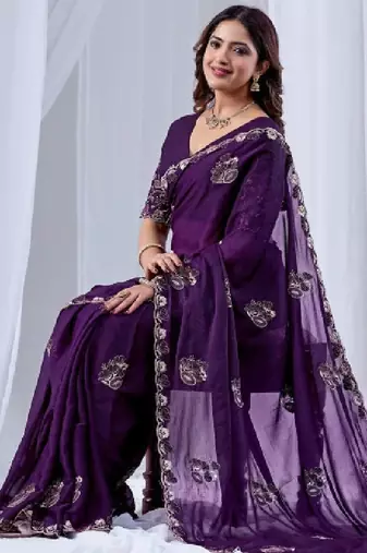 Ethnic motifs embroidered sequinned pure georgette ikat saree