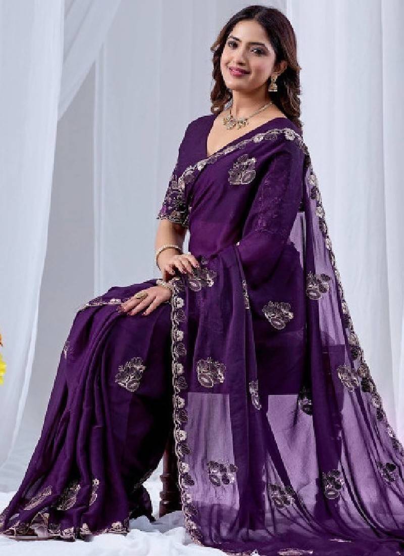 Ethnic motifs embroidered sequinned pure georgette ikat saree