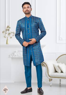 Royal blue jacket-style indo-western set with thread and stone work, perfect for weddings and festive occasions. 1