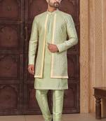Pista green jacket-style indo-western set with thread and stone work, perfect for weddings and festive occasions.