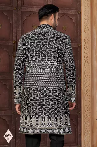 Black jacket-style indo-western set with thread and stone work, perfect for weddings and festive occasions.