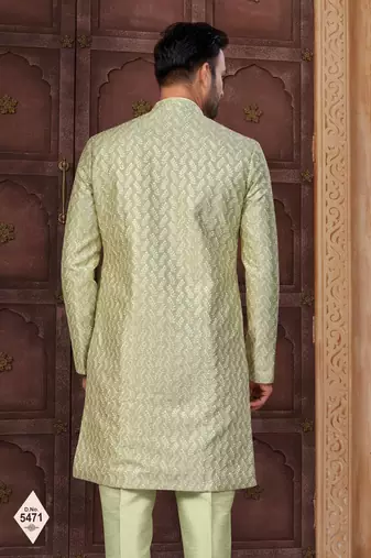 Pista green jacket-style indo-western set with thread and stone work, perfect for weddings and festive occasions.