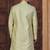 Pista green jacket-style indo-western set with thread and stone work, perfect for weddings and festive occasions.