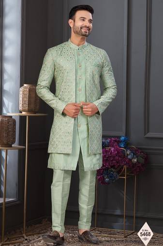 Pista green jacket-style indo-western set with thread and stone work, perfect for weddings and festive occasions.