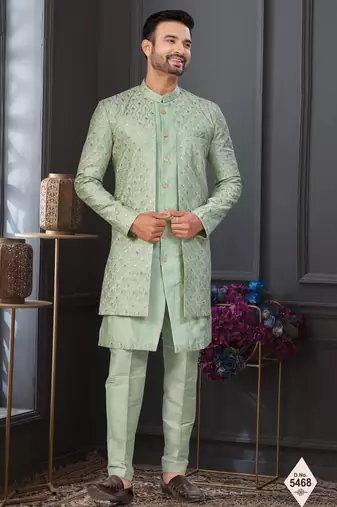 Pista green jacket-style indo-western set with thread and stone work, perfect for weddings and festive occasions.