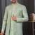 Pista green jacket-style indo-western set with thread and stone work, perfect for weddings and festive occasions.