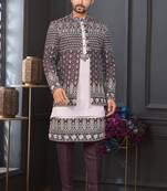 Dark maroon jacket-style indo-western set with thread and stone work, perfect for weddings and festive occasions.
