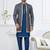 Blue jacket-style indo-western set with thread and stone work, perfect for weddings and festive occasions.