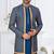Blue jacket-style indo-western set with thread and stone work, perfect for weddings and festive occasions.