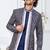 Blue jacket-style indo-western set with thread and stone work, perfect for weddings and festive occasions.