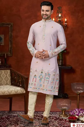 Purple colour soft silk kurta pajama set with floral buti and hem embroidery—perfect for festive wear.