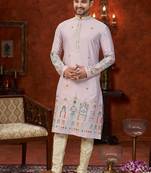Purple colour soft silk kurta pajama set with floral buti and hem embroidery—perfect for festive wear.