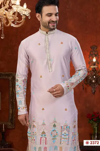 Purple colour soft silk kurta pajama set with floral buti and hem embroidery—perfect for festive wear.