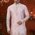 Purple colour soft silk kurta pajama set with floral buti and hem embroidery—perfect for festive wear.