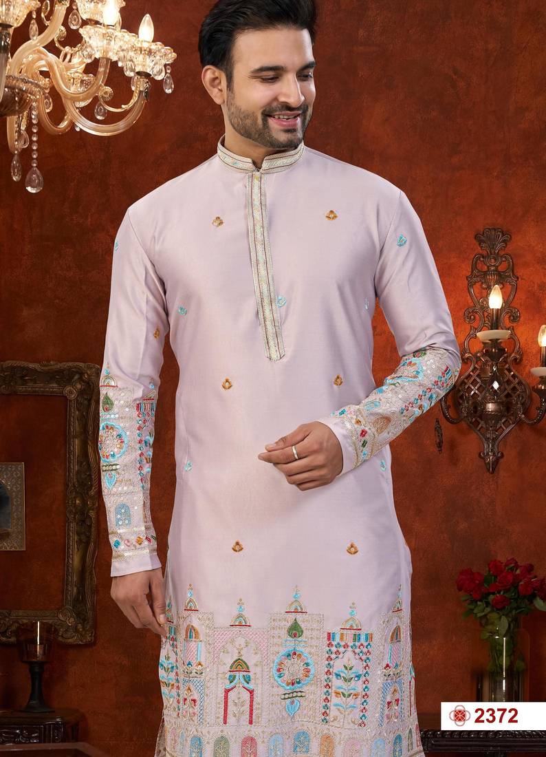 Purple colour soft silk kurta pajama set with floral buti and hem embroidery—perfect for festive wear.