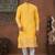 Yellow soft silk kurta pajama set with floral buti and hem embroidery—perfect for festive wear.