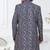 Blue jacket-style indo-western set with thread and stone work, perfect for weddings and festive occasions.