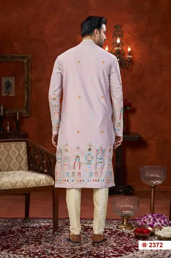 Purple colour soft silk kurta pajama set with floral buti and hem embroidery—perfect for festive wear.