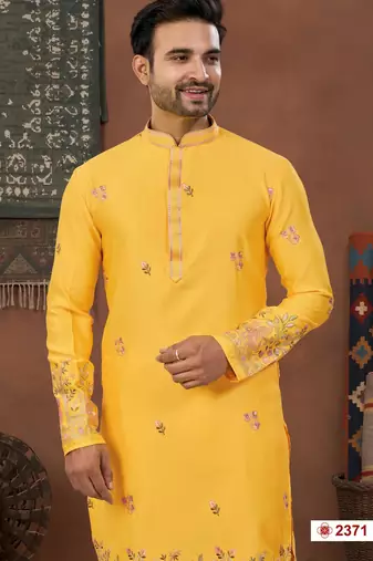 Yellow soft silk kurta pajama set with floral buti and hem embroidery—perfect for festive wear.
