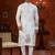 Off white soft silk kurta pajama set with floral buti and hem embroidery—perfect for festive wear.