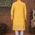 Yellow soft silk kurta pajama set with floral buti and hem embroidery—perfect for festive wear.