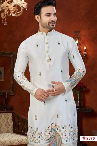Off white soft silk kurta pajama set with floral buti and hem embroidery—perfect for festive wear.