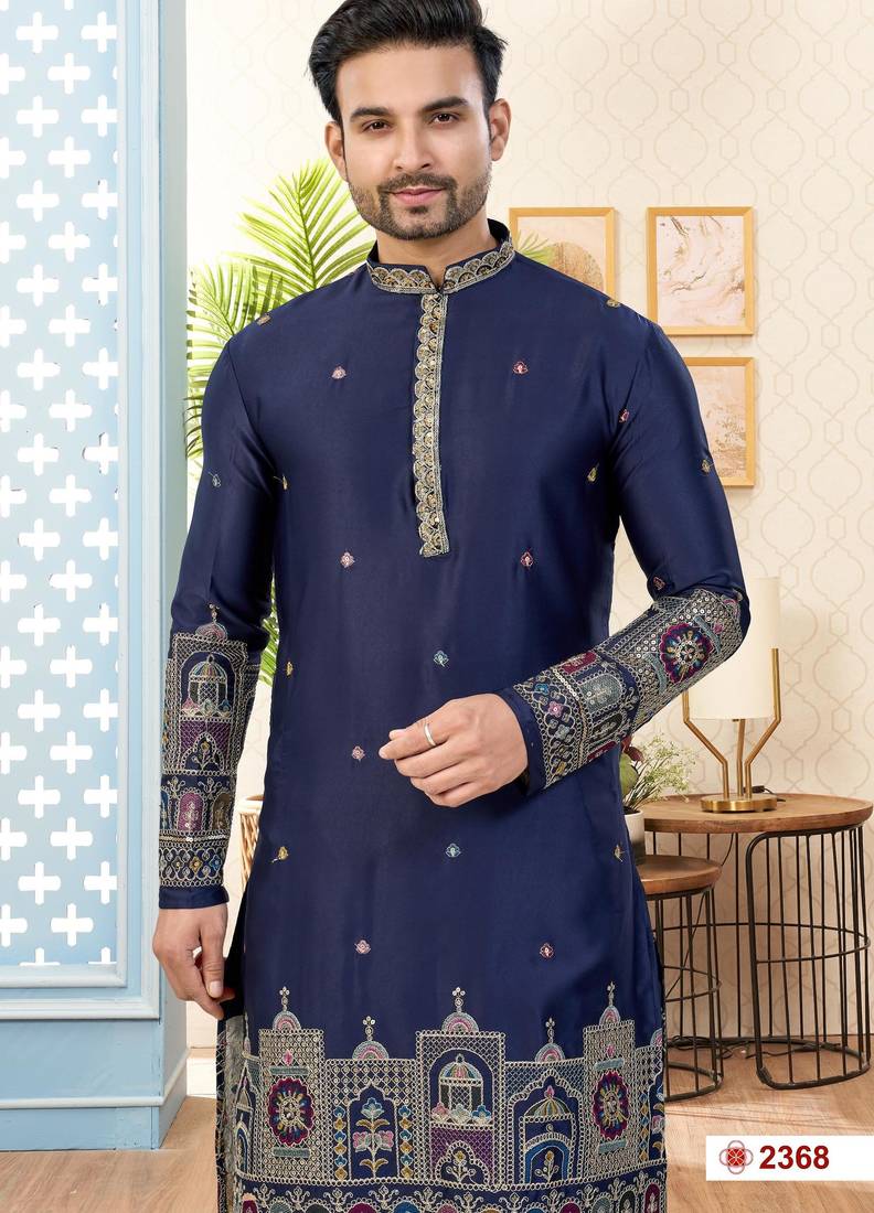 Nevy blue soft silk kurta pajama set with floral buti and hem embroidery—perfect for festive wear.