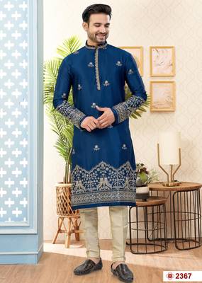 Blue soft silk kurta pajama set with floral buti and hem embroidery—perfect for festive wear. 1