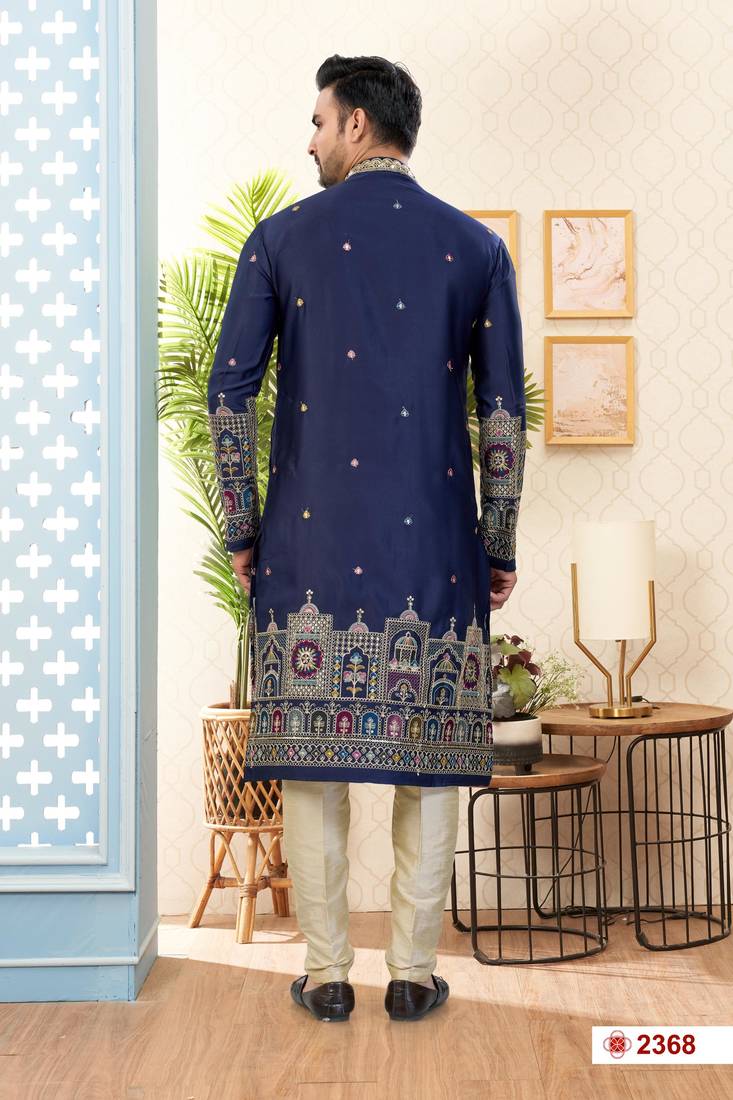 Nevy blue soft silk kurta pajama set with floral buti and hem embroidery—perfect for festive wear.