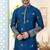 Blue soft silk kurta pajama set with floral buti and hem embroidery—perfect for festive wear.