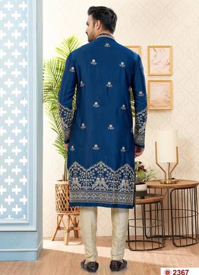 Blue soft silk kurta pajama set with floral buti and hem embroidery—perfect for festive wear. 3