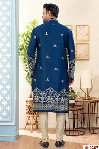 Blue soft silk kurta pajama set with floral buti and hem embroidery—perfect for festive wear.
