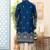 Blue soft silk kurta pajama set with floral buti and hem embroidery—perfect for festive wear.