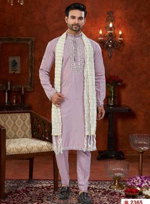 Purple soft silk kurta pajama set with beadwork on the neckline and thread embroidery on the hem. 1
