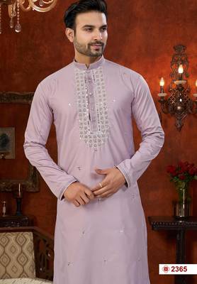 Purple soft silk kurta pajama set with beadwork on the neckline and thread embroidery on the hem. 2
