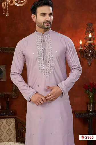Purple soft silk kurta pajama set with beadwork on the neckline and thread embroidery on the hem.