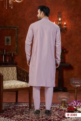 Purple soft silk kurta pajama set with beadwork on the neckline and thread embroidery on the hem. 3