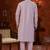 Purple soft silk kurta pajama set with beadwork on the neckline and thread embroidery on the hem.