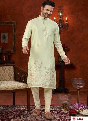 Pista green soft silk kurta pajama set with floral buti and hem embroidery—perfect for festive wear. 1
