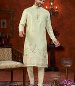 Pista green soft silk kurta pajama set with floral buti and hem embroidery—perfect for festive wear.
